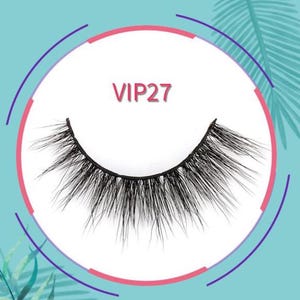 May include: A single, black false eyelash with a curved shape, set against a white background within a circular frame. The text "VIP27" is displayed in red above the lash. The background is a light teal color with a pink and purple border.