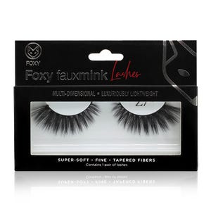 May include: A black box of Foxy fauxmink Lashes. The box has a white cutout window displaying a pair of black, tapered false eyelashes. Text on the box reads "MULTI-DIMENSIONAL • LUXURIOUSLY LIGHTWEIGHT" and "SUPER-SOFT • FINE • TAPERED FIBERS."