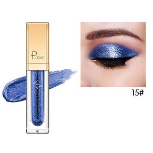 May include: A bottle of blue shimmering liquid eyeshadow with a gold cap and the brand name "Pudaier". A swatch of the eyeshadow is next to the bottle. The image also shows an eye with blue eyeshadow and the number "15#".