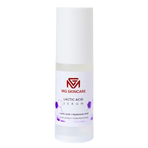 May include: A white bottle of MG Skincare Lactic Acid Serum. The label features the brand's logo, the product name, and the ingredients: Lactic Acid and Hyaluronic Acid. The bottle has a white cap and a clear base.