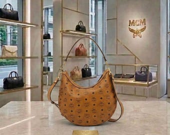 Women's Cognac Brown MCM Aren Crescent Hobo Bag, Designer Monogram Shoulder Bag