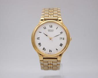 Seiko Gold Tone Quartz Dress Watch, Roman Numerals, Date Window