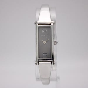 Vintage GUCCI 1500 L ladies' watch, sleek rectangular case & integrated stainless steel bangle, 1990s Swiss quartz