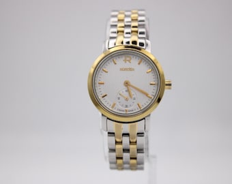 Reloj de cuarzo suizo para mujer Roamer 831.855, brazalete de acero inoxidable bicolor, esfera plateada, cristal de zafiro.