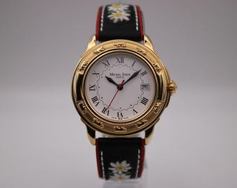 Michel Jordi 1991 Cuvee CH gold tone quartz watch with white Roman numeral dial & embroidered black leather strap