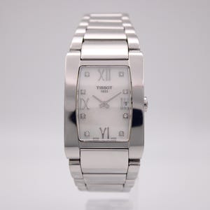 Tissot t007309 a rectangular quartz watch with mother-of-pearl dial, diamond markers & steel bracelet
