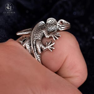 Bold lizard statement ring worn as a unique fashion accessory. Reptile-inspired sterling silver jewelry that complements gothic, punk, biker, alternative, and contemporary styles.
