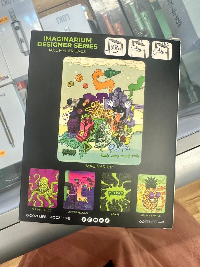 May include: A black box featuring "IMAGINARIUM DESIGNER SERIES 1/8oz MYLAR BAGS" with colorful illustrations. The main image is a whimsical scene with a rocket ship, planets, and buildings. Smaller images include an octopus, a monster, and a pineapple.