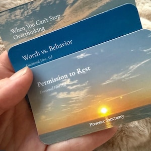 May include: Three rectangular cards with rounded corners. The top card features a blue sky with clouds and the text When You Can't Stop Overthinking. The middle card is dark blue with the text Worth vs. Behavior and Emotional First Aid. The bottom card shows a sunset over the ocean with the text Permission to Rest, Emotional First Aid, and Presence Sanctuary.