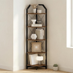 May include: A tall, corner bookshelf with five shelves. The shelves are a warm brown, and the frame is black metal. The shelves are filled with decorative items like books, vases, and a small lamp. The bookshelf is placed in a corner of a room.