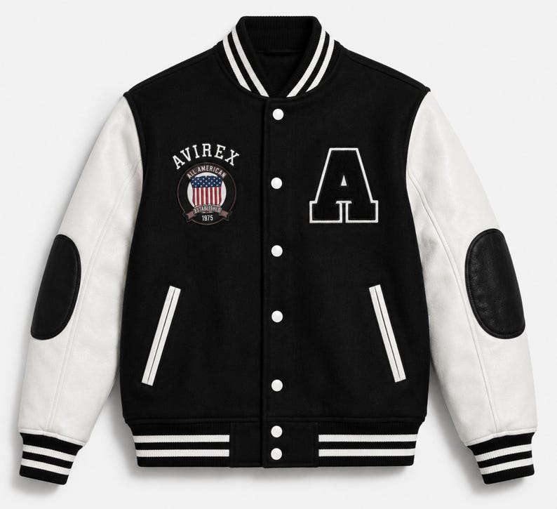 Front view of black and white AVIREX varsity jacket with embroidered patches and striped ribbed collar