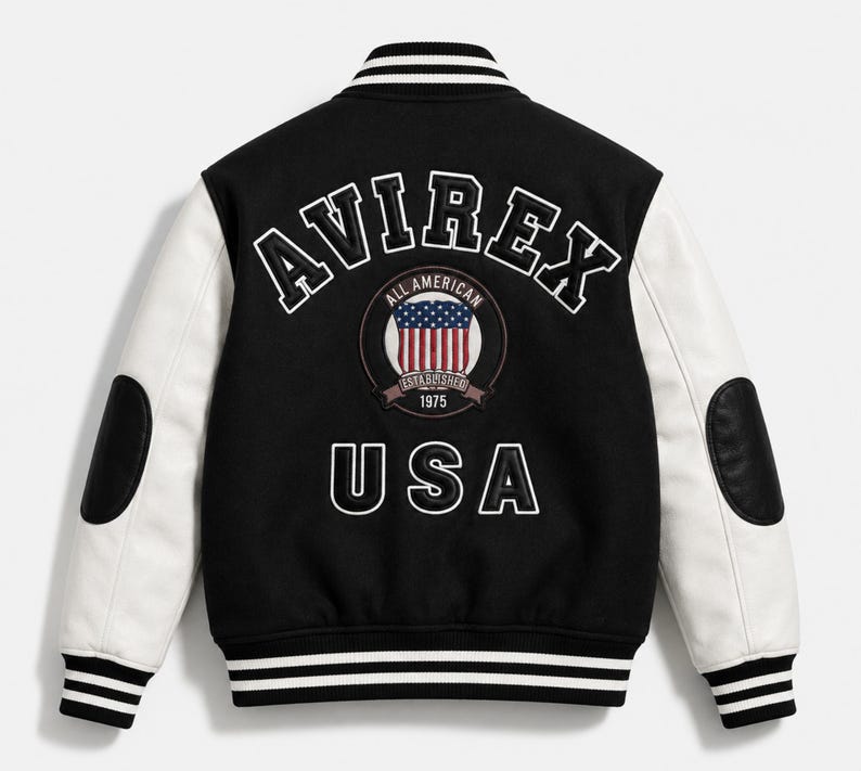 Black and white AVIREX varsity jacket back view with oversized embroidered USA logo and premium leather sleeves