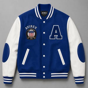 Front view of royal blue varsity bomber jacket with white sleeves and embroidered college patches”