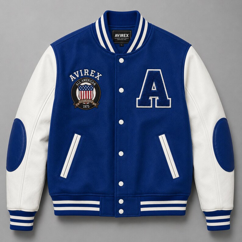 Front view of royal blue varsity bomber jacket with white sleeves and embroidered college patches”