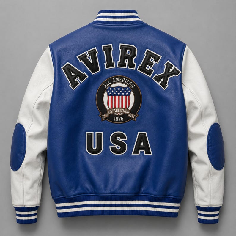 Blue and white varsity jacket back view with oversized AVIREX USA embroidery and premium leather sleeves”