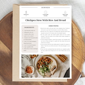 May include: A recipe card for Chickpea Stew with Rice and Bread, featuring a wooden serving board. The card includes ingredients and directions, with a photo of the finished dish. The text on the card reads "DINNER" and "Chickpea Stew With Rice And Bread".