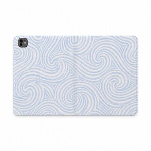 May include: A rectangular tablet case featuring a repeating pattern of light blue and white swirling lines that create a wave-like effect across the entire surface. The case includes a circular camera cutout located in the upper left corner.
