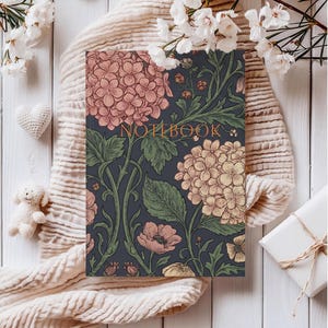 May include: A set of three ceramic mugs with a speckled, matte finish. The mugs are in shades of cream, light gray, and dark gray. Each mug has a simple, minimalist design and a rounded handle.