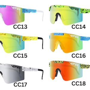 May include: A collection of Viper sunglasses in various color combinations. The sunglasses have a shield-style design with colorful lenses and patterned arms. Each pair is labeled with a "CC" code, such as CC13, CC14, CC15, CC16, CC17, and CC18.