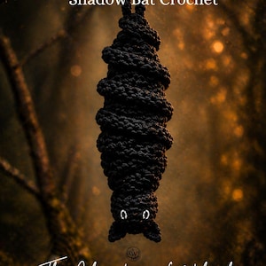 May include: A black crochet bat hangs from a branch, with white eyes and a detailed, textured body. The text "Shadow Bat Crochet" is above the bat. The shop name "The Christmas Witch shop" is below the bat, with "Crochet Patterns & Spooky Vibes" underneath.
