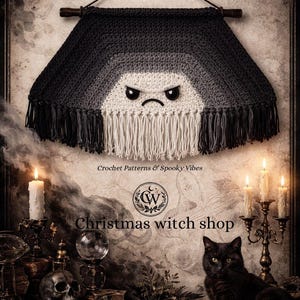 May include: A dark, crochet wall hanging with a grumpy face design, fringe, and a wooden rod. The text "Dark Cloud Tunnel Wall Hanging pattern" is visible. The image also includes the text "Christmas witch shop".