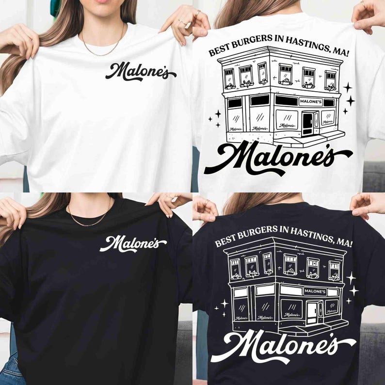 May include: White and black t-shirts with the Malone's logo on the front. The back of the shirts feature a detailed illustration of a restaurant with the text "Best Burgers in Hastings, MA!". The Malone's logo is also on the back.