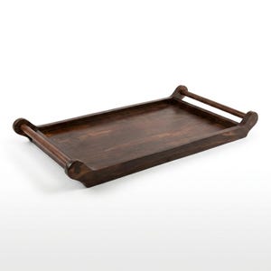 May include: A rectangular wooden serving tray with a dark brown finish. The tray has rounded handles on each end, providing a classic and elegant look. The tray is designed for serving food or drinks.