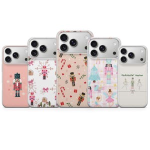 May include: Five smartphone cases featuring holiday-themed designs. The cases display patterns of nutcrackers, candy canes, snowflakes, ballet dancers, and Christmas trees. The rightmost case features the text Nutcracker season in script font.