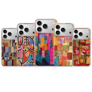 May include: Five phone cases with colorful abstract art designs. The cases feature a variety of patterns, including geometric shapes, vertical lines, and watercolor-style blocks. Each case has a different color palette, with hues of red, blue, orange, and green.