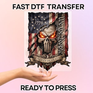 May include: A DTF transfer featuring a skull with glowing orange eyes, superimposed on a distressed American flag design. The design includes the text "1776", "We the People", and "Liberty or Death". The words "FAST DTF TRANSFER" and "READY TO PRESS" are also visible.
