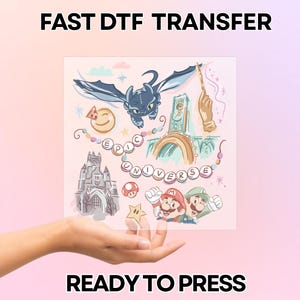 May include: A pink DTF transfer with various cartoon illustrations, including a dragon, a castle, and characters from popular video games. The text "EPIC UNIVERSE" is displayed, along with "FAST DTF TRANSFER" and "READY TO PRESS".