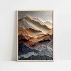 May include: A framed art print featuring a textured, layered mountain landscape. The artwork showcases a gradient of colors, from dark blues and grays at the base to warm browns and tans, culminating in a light, off-white peak. The frame is a light wood.