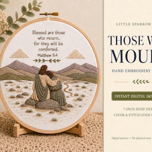 May include: A 7-inch embroidery hoop containing a fabric panel with a hand-stitched scene of two figures sitting on rocks in a landscape with mountains and clouds. The text reads: Blessed are those who mourn, for they will be comforted. Matthew 5:4.