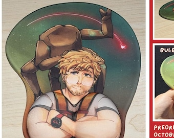 May include: A mousepad featuring an illustration of a blonde person with glasses and a brown robotic figure against a green space background. The mousepad includes a bulbous wrist support shaped like muscular arms with the text PHM GRACE & ROCKY MOUSEPAD.