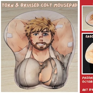 May include: A mousepad featuring an illustration of a bearded person with blonde hair, wearing a torn white garment. The design includes two raised, rounded wrist rests at the bottom. Text on the image reads: TORN & BRUISED COLT MOUSEPAD, SAFE FOR WORK, ERGONOMIC WRIST RESTS, PREORDER BY OCTOBER 9, 2026, ART BY MO AYATO.