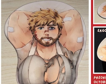 May include: A mousepad featuring an illustration of a bearded person with blonde hair, wearing a torn white garment. The design includes two raised, rounded wrist rests at the bottom. Text on the image reads: TORN & BRUISED COLT MOUSEPAD, SAFE FOR WORK, ERGONOMIC WRIST RESTS, PREORDER BY OCTOBER 9, 2026, ART BY MO AYATO.