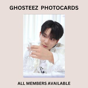 May include: A rectangular Ghosteez photocard featuring a person with dark hair wearing a white shirt, holding a clear glass. The text GHOSTEEZ PHOTOCARDS appears at the top, and Your Friendly Ghost is written in script at the bottom, with ALL MEMBERS AVAILABLE below.