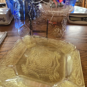 May include: A set of three ceramic mugs with a speckled, matte finish. The mugs are in shades of cream, light gray, and dark gray. Each mug has a simple, minimalist design and a rounded handle. Perfect for coffee or tea.