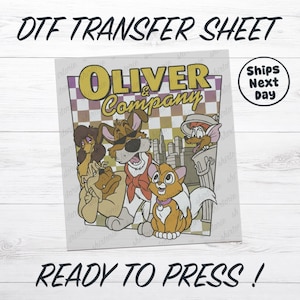 May include: DTF transfer sheet featuring the Oliver & Company cartoon characters. The design includes the film's title in yellow and the phrase "Ready to Press!" in black. The image has a checkered background and a "Ships Next Day" graphic.
