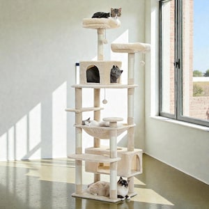 May include: A beige multi-level cat tree with various platforms, a hammock, and enclosed spaces. Several cats are resting on the different levels. The cat tree includes scratching posts and dangling toys.