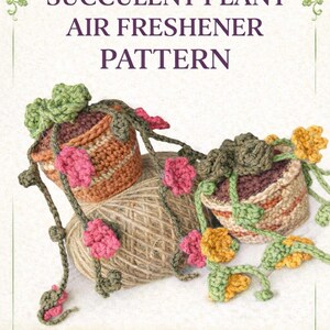 May include: Image of a crochet succulent plant air freshener pattern. The image features two small, crocheted plant pots with attached vines and flowers in shades of pink, green, and yellow. A ball of twine sits between the pots.