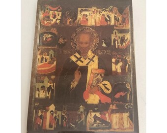 Placa de madera independiente con la imagen de San Nicolás y escenas de su vida, de estilo vintage.