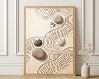 May include: A framed print depicting a zen garden scene. The artwork features smooth, rounded stones of varying shades of gray and brown, set against a background of meticulously raked sand with curved lines. The frame is made of light-colored wood.