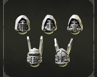May include: A set of five miniature grey resin helmet heads for gaming figures. The top row features three hooded helmets with face grilles. The bottom row displays two helmets with vertical wing attachments, one with a perforated faceplate and one with a slatted visor. The text 'Heads 2' and 'Greytide Studio' are visible.