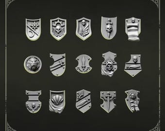 May include: A collection of fifteen grey miniature shoulder shields arranged in three rows of five. Each shield features distinct embossed designs including skulls, swords, daggers, a lion head, a seashell, and scrolls. The text Shoulder shields 1 is at the top.