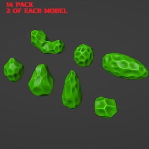 May include: A collection of seven green, geometric-shaped objects. The objects vary in shape, including a sphere, a teardrop, and a rectangular form. The text "14 PACK 2 OF EACH MODEL" is in red at the top of the image.