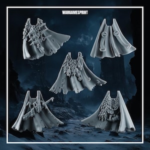 May include: Five grey miniature capes for tabletop gaming figures, each featuring unique details like fur collars, skulls, swords, and pouches. The text WARGAMESPRINT is displayed at the top center of this collection of unpainted resin gaming accessories.