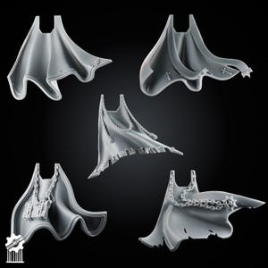 May include: A set of five grey miniature capes for gaming figures. The capes feature various sculpted details including hanging chains, a small rectangular box, skull motifs along the hem, and small cross emblems. Each cape has a distinct flowing shape.