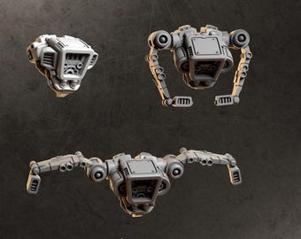 May include: Three grey miniature jetpack components for tabletop gaming figures. The set includes one compact jetpack unit and two larger jetpack units with articulated mechanical arms and thruster details. The text JETPACKS and GREYTIDE STUDIO appears.