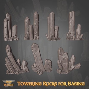 May include: A collection of gray, stylized rock formations, varying in size and shape, suitable for basing. The image features multiple groupings of jagged, towering rocks, with a dark background. The text "Towering Rocks for Basing" is displayed at the bottom.